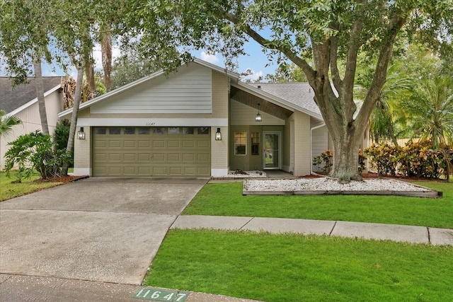 view of front facade featuring a front yard and a garage