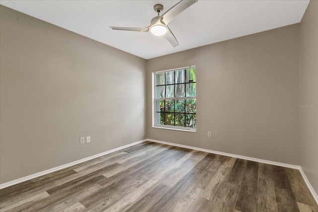 empty room featuring hardwood / wood-style floors and ceiling fan