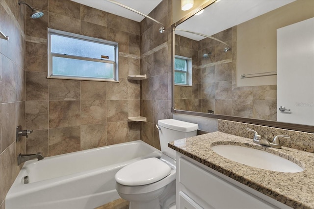 full bathroom with tiled shower / bath combo, toilet, and large vanity