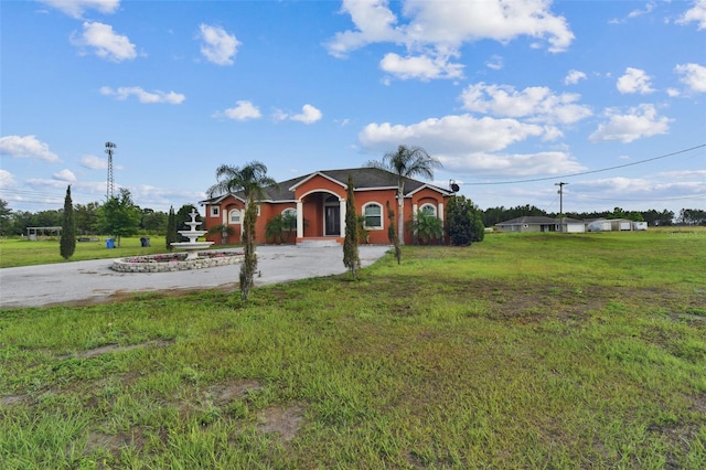 single story home with a front yard