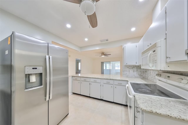 kitchen featuring backsplash, white cabinets, light tile patterned floors, white appliances, and ceiling fan