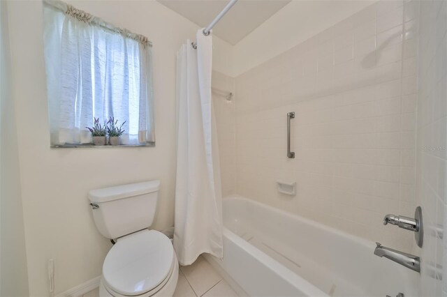 bathroom with tile patterned flooring, toilet, and shower / tub combo with curtain