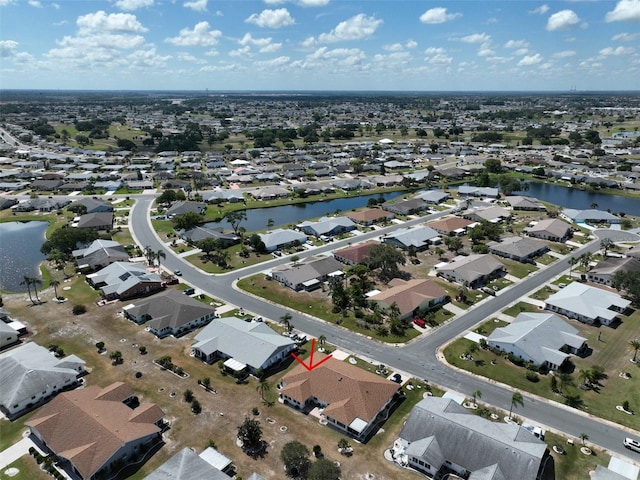 birds eye view of property featuring a residential view and a water view