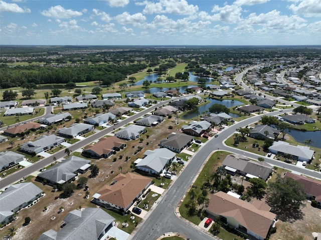 drone / aerial view featuring a water view and a residential view