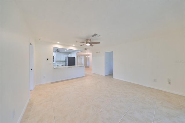 unfurnished living room featuring recessed lighting, baseboards, visible vents, a ceiling fan, and light tile patterned flooring