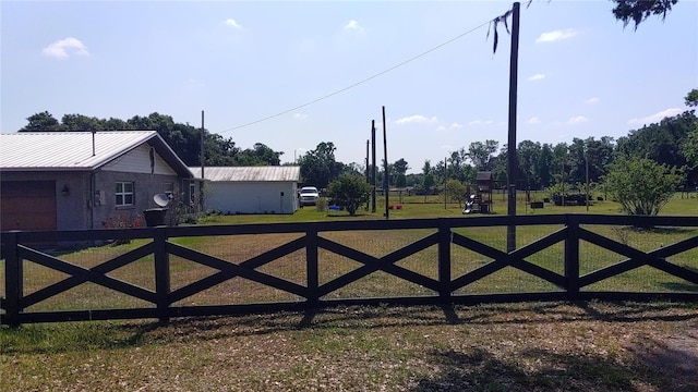 view of gate featuring a lawn