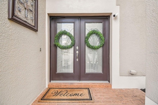 doorway to property featuring french doors