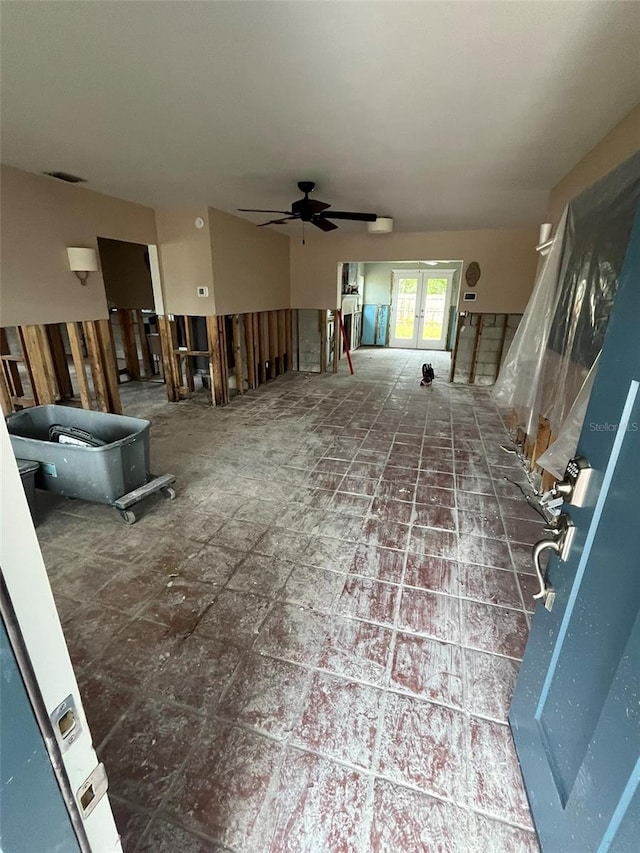 interior space featuring french doors and ceiling fan