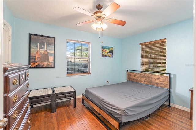 bedroom with ceiling fan and hardwood / wood-style flooring