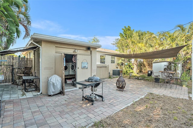 view of patio / terrace featuring central AC and washer and dryer