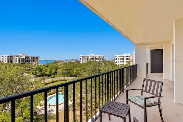 balcony featuring a water view