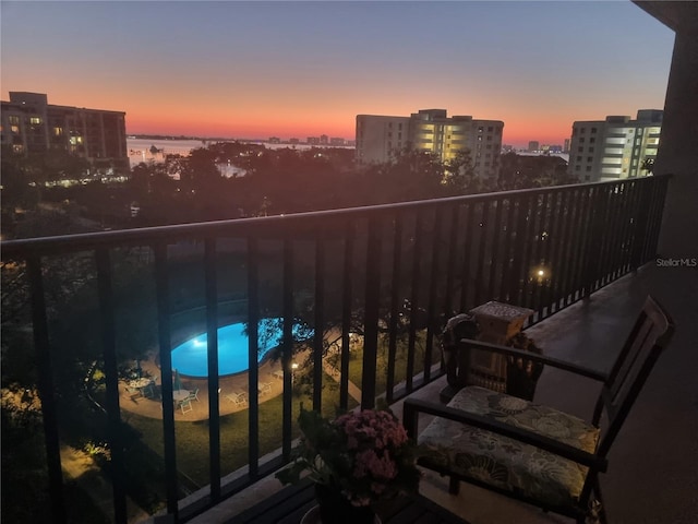 view of balcony at dusk