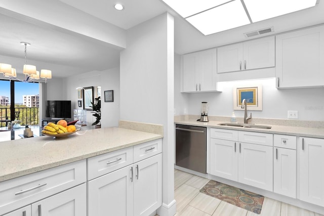 kitchen with sink, white cabinets, hanging light fixtures, stainless steel dishwasher, and light stone countertops