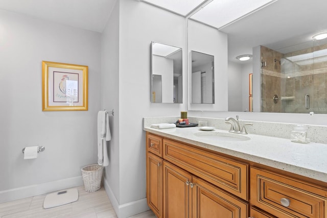 bathroom with vanity and walk in shower