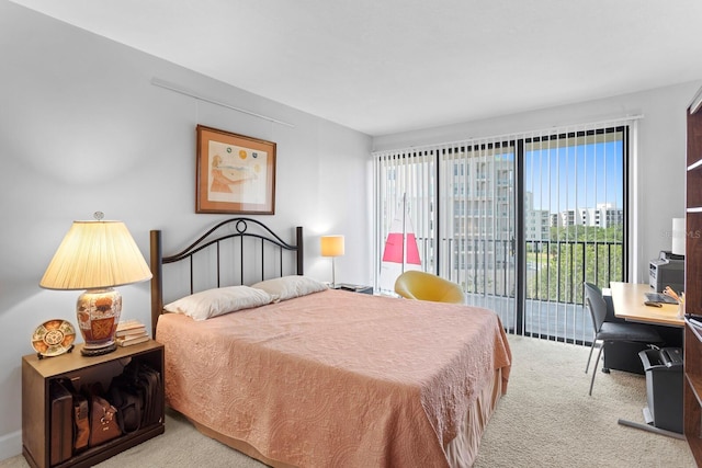 bedroom featuring light colored carpet and access to outside