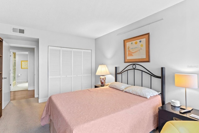 bedroom with light colored carpet and a closet