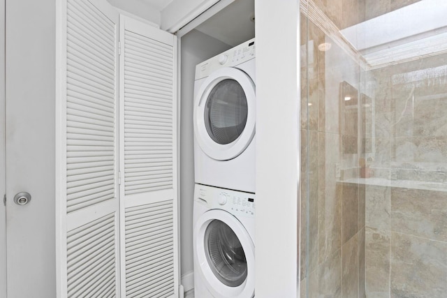 laundry room featuring stacked washer and clothes dryer