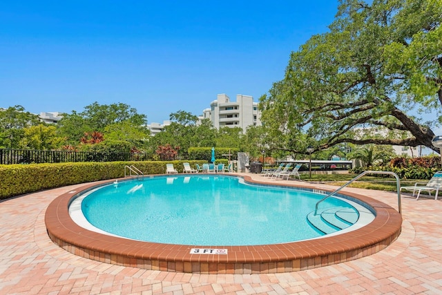 view of swimming pool with a patio area