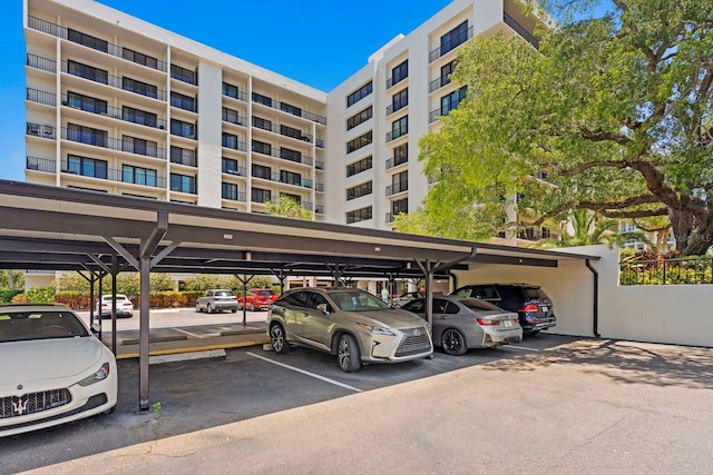 view of vehicle parking with a carport