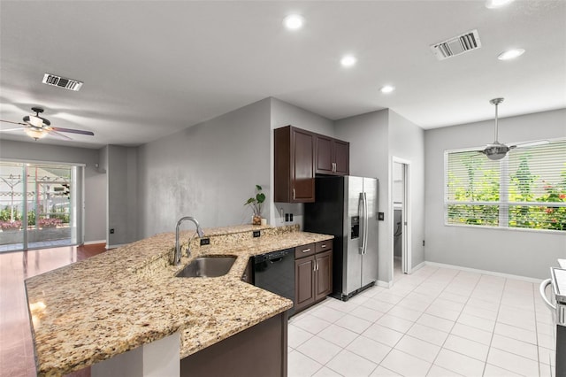 kitchen featuring light stone countertops, sink, stainless steel fridge with ice dispenser, dishwasher, and ceiling fan