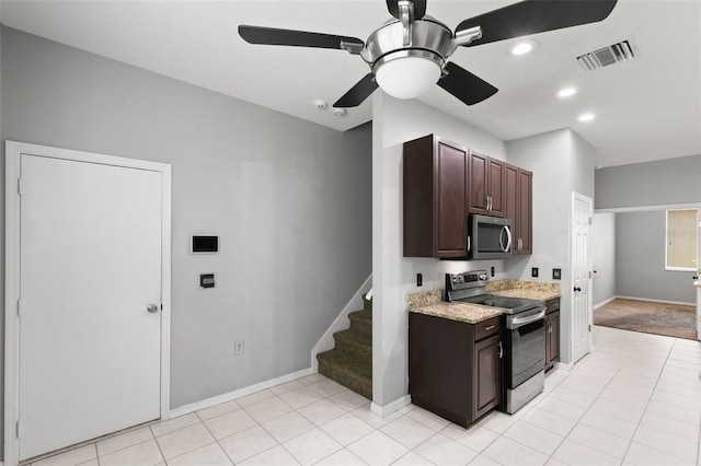 kitchen with light colored carpet, stainless steel appliances, ceiling fan, and dark brown cabinetry