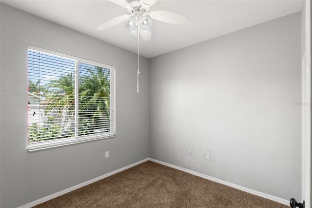 carpeted empty room with ceiling fan