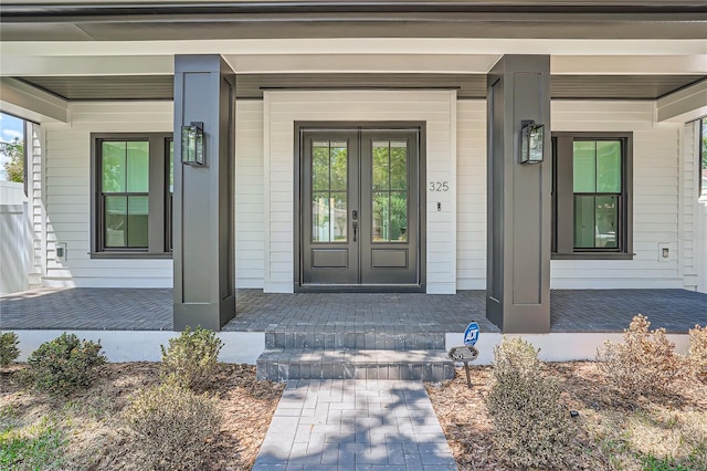 doorway to property featuring french doors and a porch