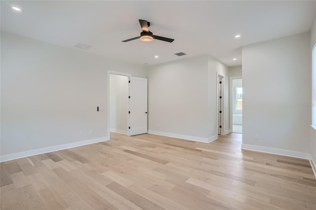 empty room featuring light wood-type flooring and ceiling fan