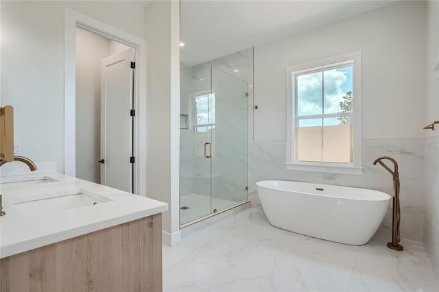 bathroom with shower with separate bathtub, dual bowl vanity, tile flooring, and tile walls