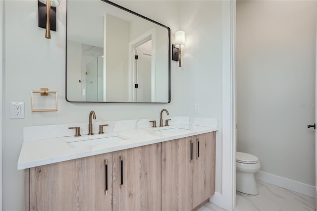 bathroom with dual sinks, toilet, tile floors, and large vanity