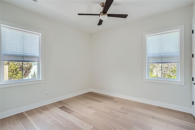 empty room with light hardwood / wood-style floors and ceiling fan