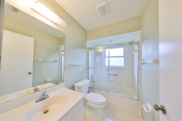 full bathroom with enclosed tub / shower combo, toilet, tile flooring, and vanity