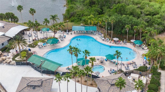 view of swimming pool featuring a community hot tub and a patio