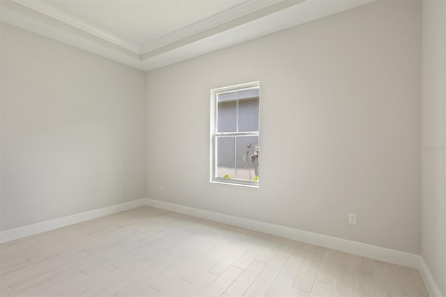 unfurnished room featuring light wood-style flooring and baseboards