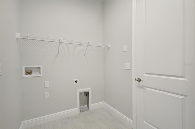 clothes washing area with hookup for an electric dryer, light wood-type flooring, and hookup for a washing machine