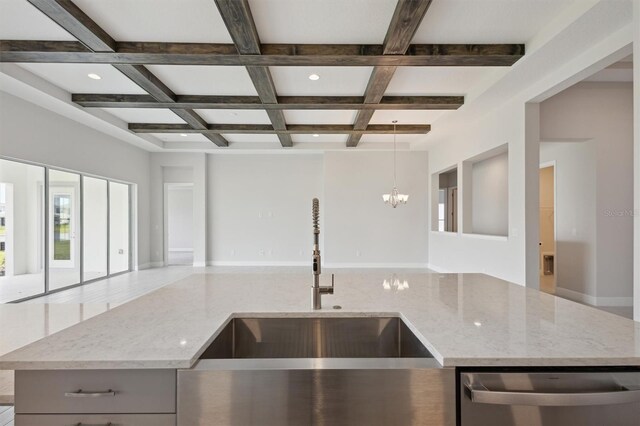 kitchen with beam ceiling, stainless steel dishwasher, coffered ceiling, sink, and light stone countertops