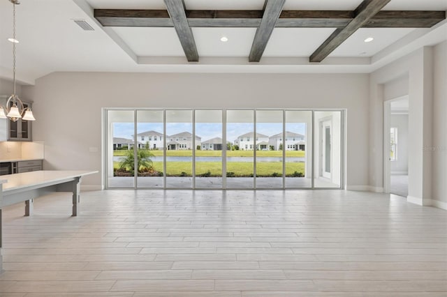 unfurnished living room featuring coffered ceiling, beamed ceiling, and light hardwood / wood-style floors