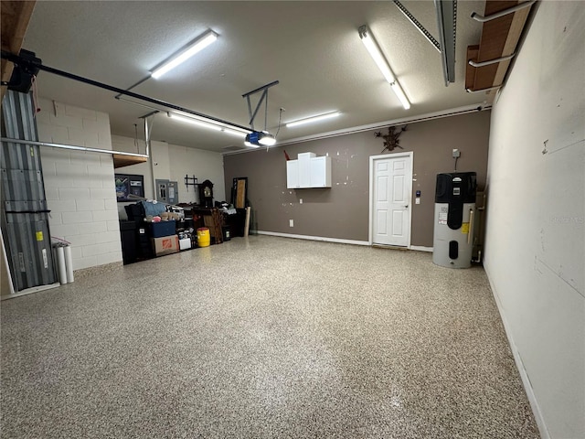 garage with a garage door opener and heat pump water heater