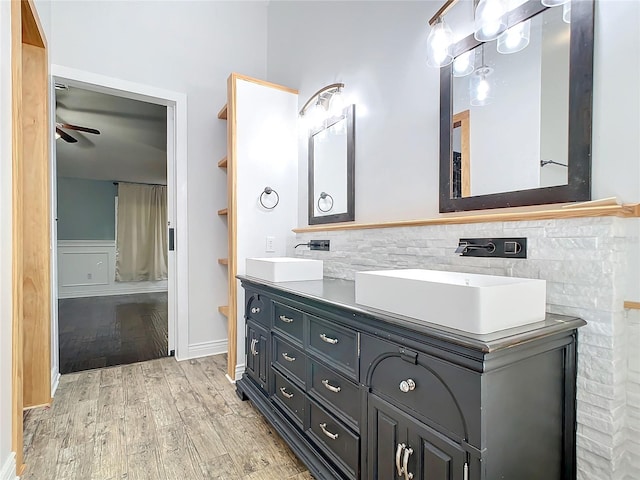 bathroom with hardwood / wood-style flooring, vanity, and ceiling fan