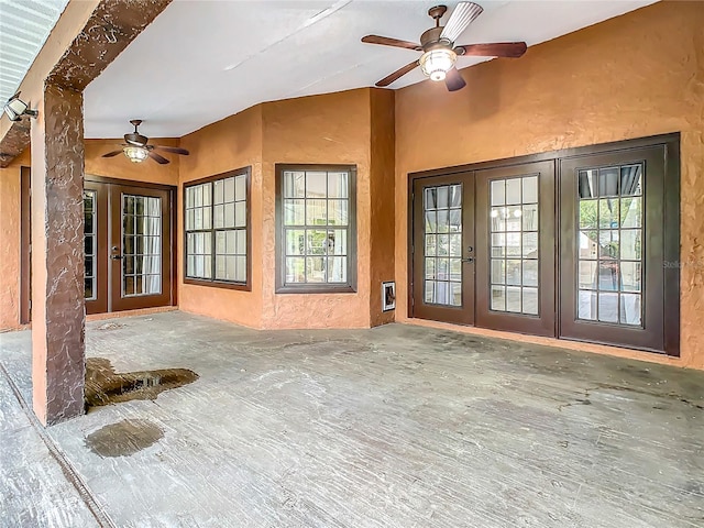 property entrance with ceiling fan, french doors, and a patio