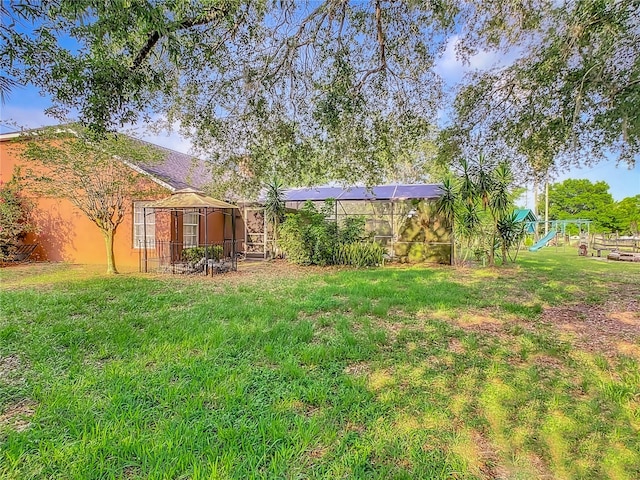 view of yard with a lanai