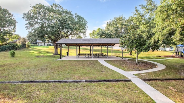 view of property's community with a gazebo and a yard