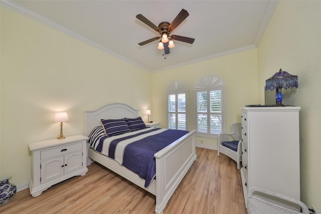 bedroom with ceiling fan, light hardwood / wood-style floors, and ornamental molding