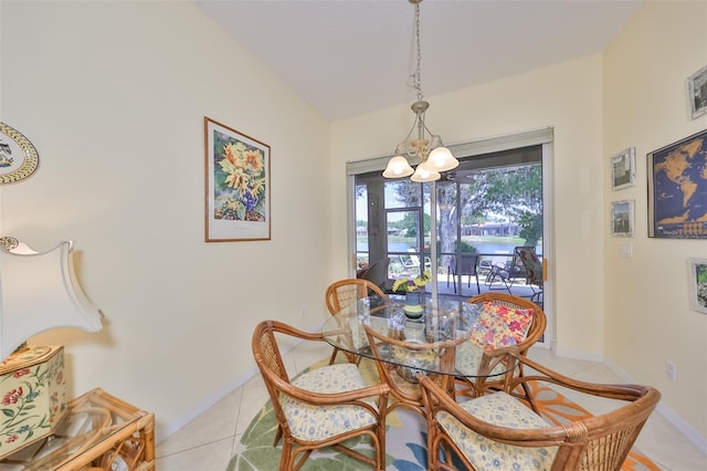 dining area featuring a notable chandelier and tile flooring