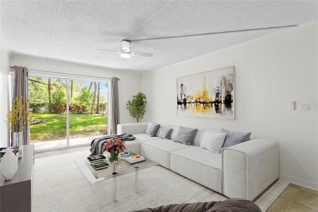 tiled living room with ceiling fan and a textured ceiling