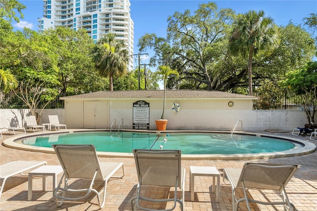 view of swimming pool with a patio