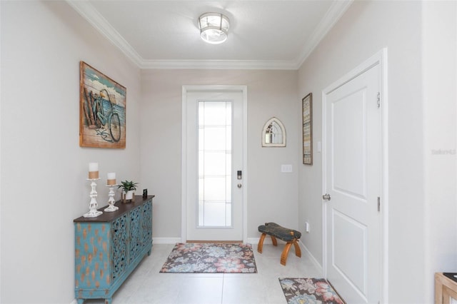 entrance foyer with ornamental molding and light tile patterned floors