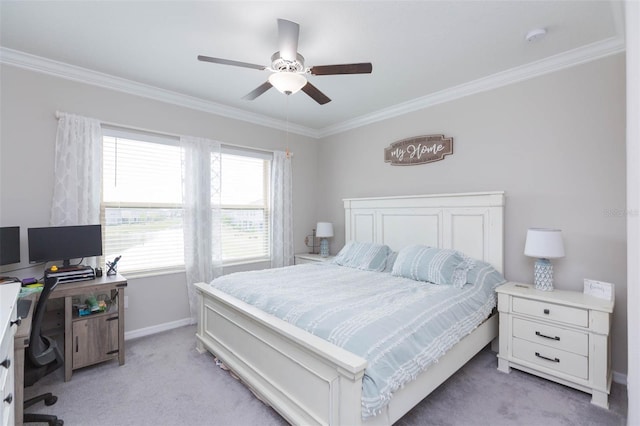 carpeted bedroom featuring ceiling fan and ornamental molding