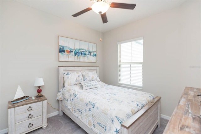 bedroom featuring ceiling fan and light carpet