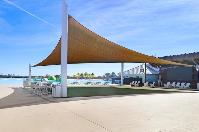 view of patio featuring a water view